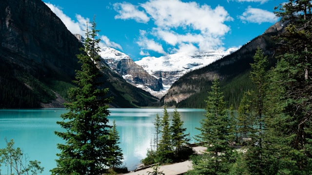 15 Most Beautiful Places in the World You Must Visit in 2026 5 Lake Louise surrounded by mountains in Banff National Park.