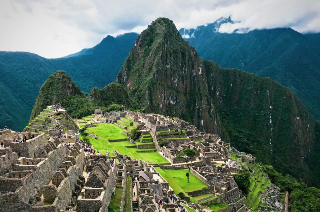 15 Most Beautiful Places in the World You Must Visit in 2026 15 Machu Picchu ruins surrounded by mountains.