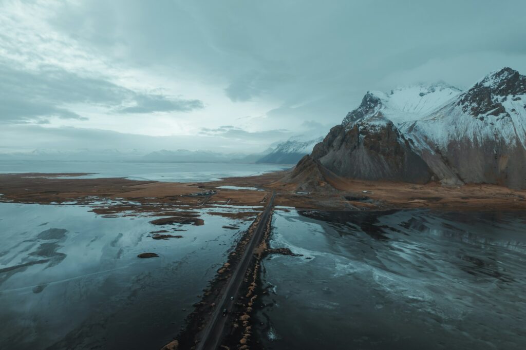 15 Most Beautiful Places in the World You Must Visit in 2026 10 Northern lights over Icelandic landscape.